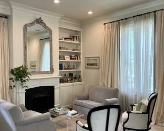 pair of loveseats, contemporary bergeres, acrylic coffee table. **bookshelf items, mirror, and drapes NFS. 