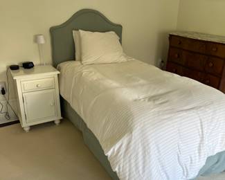 upholstered twin bed, twin bedding, bedside table