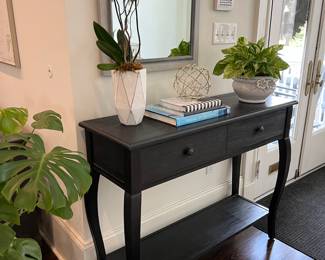 entry console, assorted decor and plants