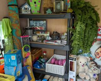 Outbuilding holds some garden tools, household supplies, bird houses, some Christmas, outdoor games etc