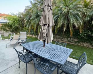 Iron Patio set with (6) chairs, two swivel & umbrella