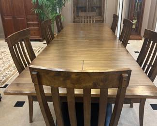 GORGEOUS high end formal dining table in excellent condition. Three leaves that fold under - each leaf 18" long. Totally extended this table is approximately 132".