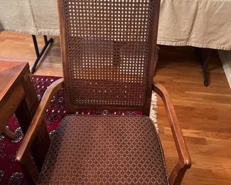 Close up of one of the two Captain's chairs included in the dining table set.