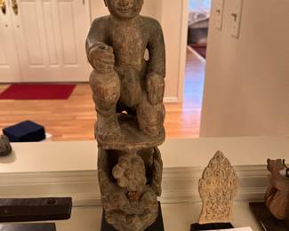 $280. Hand carved Asian wooden Buddha. A screw through the front holds it together - we believe it may have been a door knocker originally.