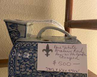 $500 Blue and white porcelain bed pan with stamped handle. 7 3/4"l x 6"h x 4 3/4"w.