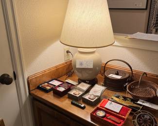 More items for sale during in-person shopping including stamps and lamp.