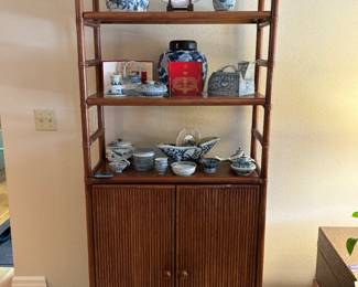 $350. Custom made Bamboo étagere. 32"w x 13.5"d x 53.5"h. As found - doors hiding one shelf need a new magnet to keep them closed. Items on the shelves have mostly sold.