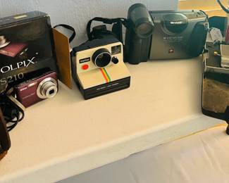 Polaroid, Sharp, Cannon, Vitaflex vintage cameras
