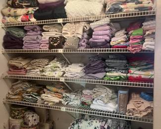 Lots of linen, towels, bedding and table sets