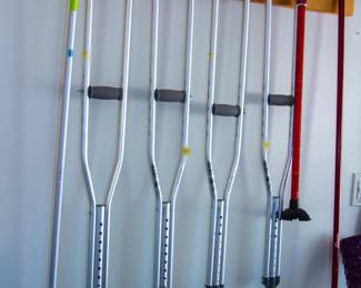 Various sized crutches and cane