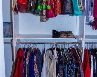 Various designer purses and women's clothing 