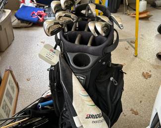 lots of golf equipment, decor and paraphernalia.