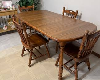 Dining table with 4 chairs. It’s approximately 40+ years old, dings and wear with age, but built to last another 40 years.