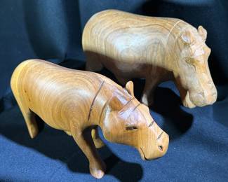 The name hippopotamus comes from the Greek word meaning “river horse.” These hippos are carved from wood.