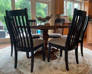 Bassett artisan dining table, F&N woodworking chairs, Surya round rug
