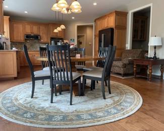 Paisley arm chair, Quoizel lamp, Bassett end table, Bassett artisan dining table, F&N woodworking chairs, Surya round rug
