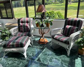 Set of 2 armchairs and 1 ottoman with unique cushions and a glass top lamp table with bronze tennis player lamp base and crossed tennis rackets supporting the glass top