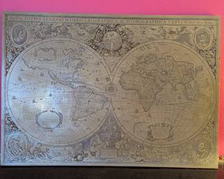Brass relief old world map
