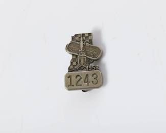 Lot 28
1958 Indianapolis Motor Speedway silver pit badge 1"H x 5/8"W  1958 Indianapolis Motor Speedway silver pit badge
This 1958 Indianapolis Motor Speedway silver pit badge #1243 is a rare and collectible piece of racing history. Crafted with intricate detail, this badge features the iconic Speedway logo and the year 1958 engraved on the front. Made of high-quality silver, this pit badge is a must-have for any racing enthusiast or memorabilia collector looking to own a piece of the legendary Indianapolis Motor Speedway's history. Perfect for display or as a unique gift for a motorsports fan, this silver pit badge is a timeless keepsake that captures the excitement and prestige of the Indy 500.