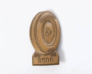 Lot 21
1952 Indianapolis Motor Speedway bronze pit badge #2500 2 1/4"H x 1 1/4"W