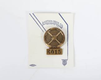 Lot 25
1955 Indianapolis Motor Speedway Bronze pit badge 2 3/4"H x 2 1/4"W (card)  This 1955 Indianapolis Motor Speedway bronze pit badge #5015 is a rare and collectible piece of racing history. Made of durable materials, this badge features the iconic Speedway logo and design from the 1950s. Perfect for any racing enthusiast or collector, this pit badge is a must-have for anyone looking to own a piece of the legendary Indianapolis Motor Speedway's past. Add this unique item to your collection today and showcase your love for motorsports. Marked Bastian Bros. Co. Rochester NY" on back of pin among other markings.