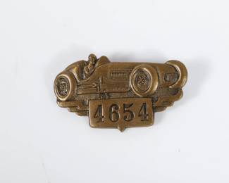 Lot 23
1954 Indianapolis Motor Speedway bronze pit badge 1"H x 1 1/2"W