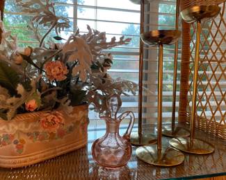 Decoratives including floral arrangements and brass candlesticks