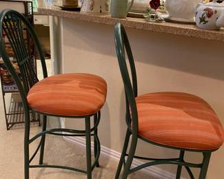 Metal barstool, dark green with burnt orange fabric on cushions
