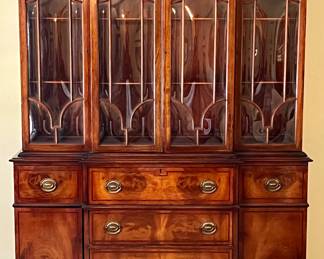 Amazing New England made flame mahogany break front with leaded glass inset doors