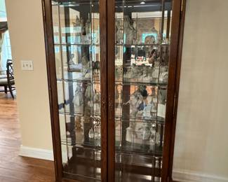 78 inches tall, 16 inches deep, 42 inches high lighted curio cabinet