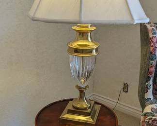 Round side table with inlay. Brass base glass lamp