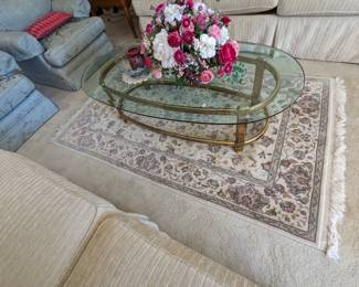 Glass top with brass base oval table