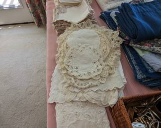 Doilies, napkins, handmade crocheted table cloths (not shown)