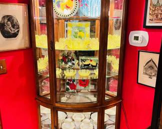 Glass curio cabinet filled with goodies 
