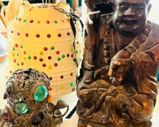 Super neat vintage items like this hanging lamp, candle holder, and Buddha statue.    
