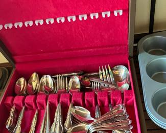 Set of silverware in storage container