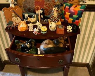 Close up of occasional table with “Cats” decor