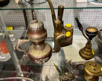 assortment brass, pipes, jewelry