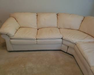 Beautiful creamy white L-shaped sofa. On excellent condition. Comes in 3 sections.