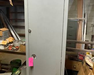 Double sided storage cabinet