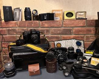 Nikon AF-S 28mm-70 mm Lens ,
Nikon F Photomic Film Camera 
Nikon F SLR View Finder Accessory 