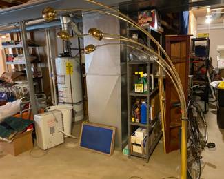 mid-century modern gold lamp goes over the couch