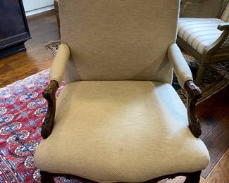 Intricately Carved Wheat color upholstered chair 