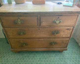 Early Rustic four drawer chest with bun feet
