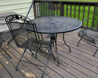 Wrought Iron patio table and 4 chairs