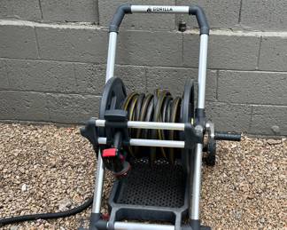 Almost new gorilla hose and carrier.