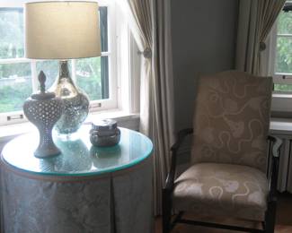 Upholstered chair, table, lamp