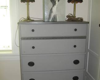 Painted vintage dresser, antique lamps, photography book by Richard Avedon