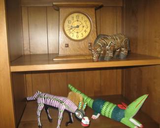  Stickley analog clock, Mexican animal figures in an Ethan Allen bookcase