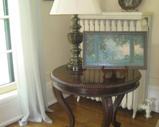 Antique round occasional table, Stiffel lamp (one of a pair), framed vintage prints
